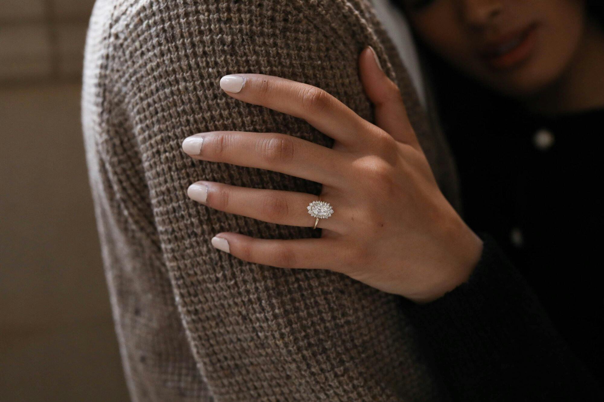 a girl wearing an engagement ring