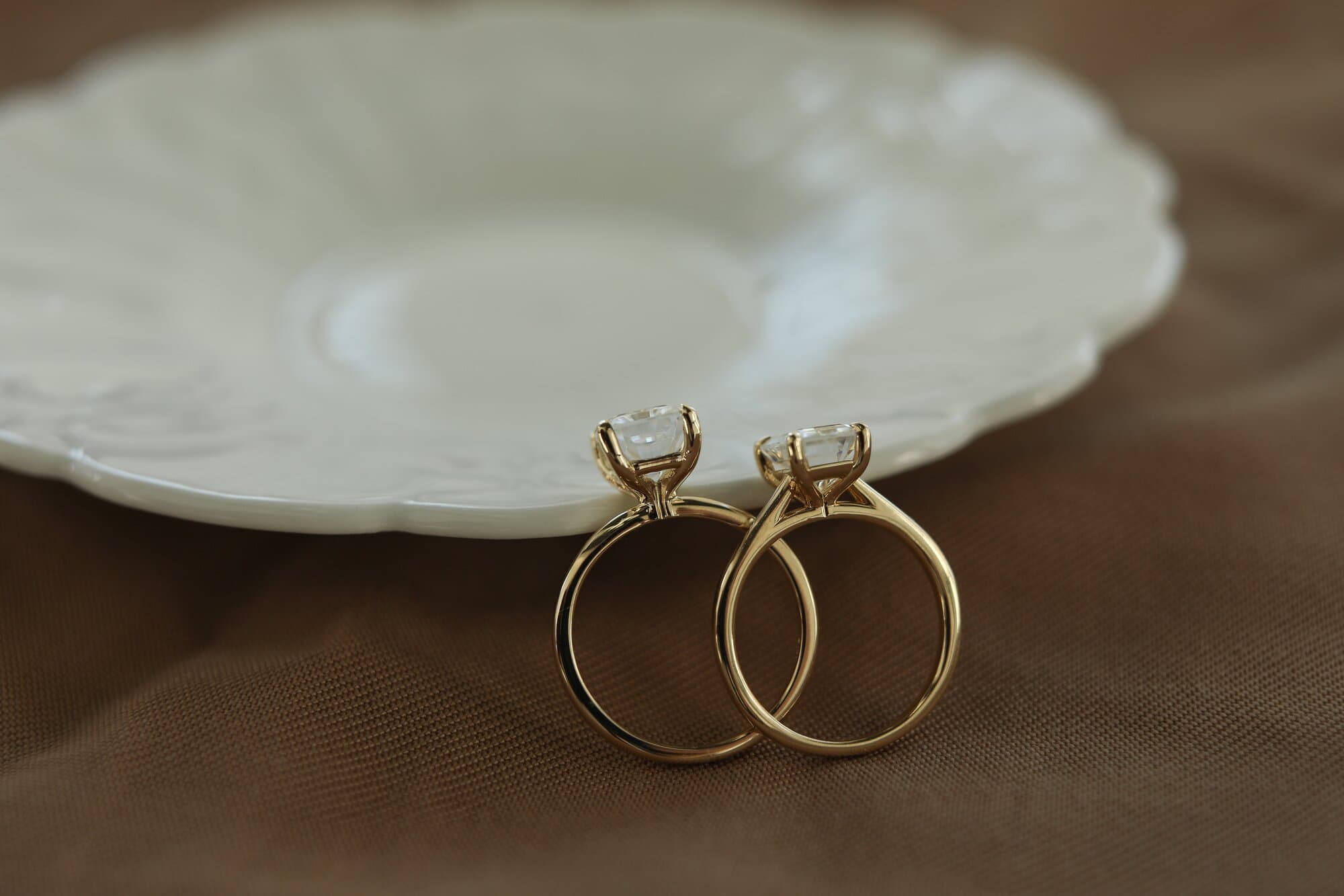 two engagement rings with the profile setting