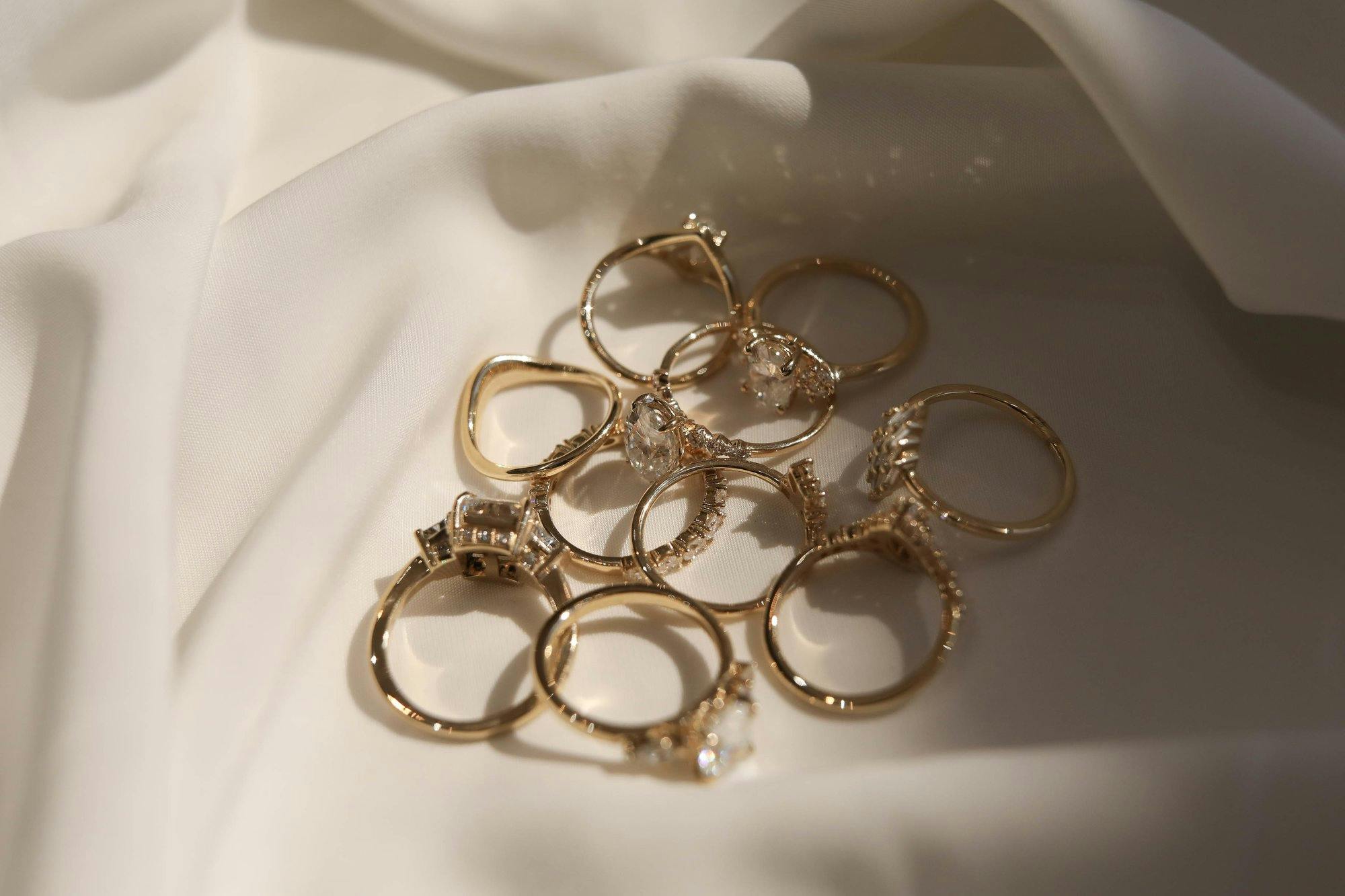 a group shot of engagement rings and bands