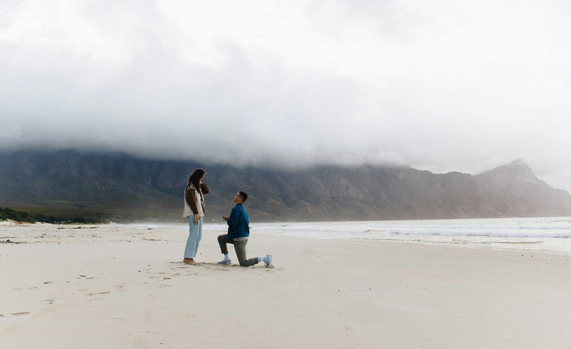 A proposal on a white sandy beach. 