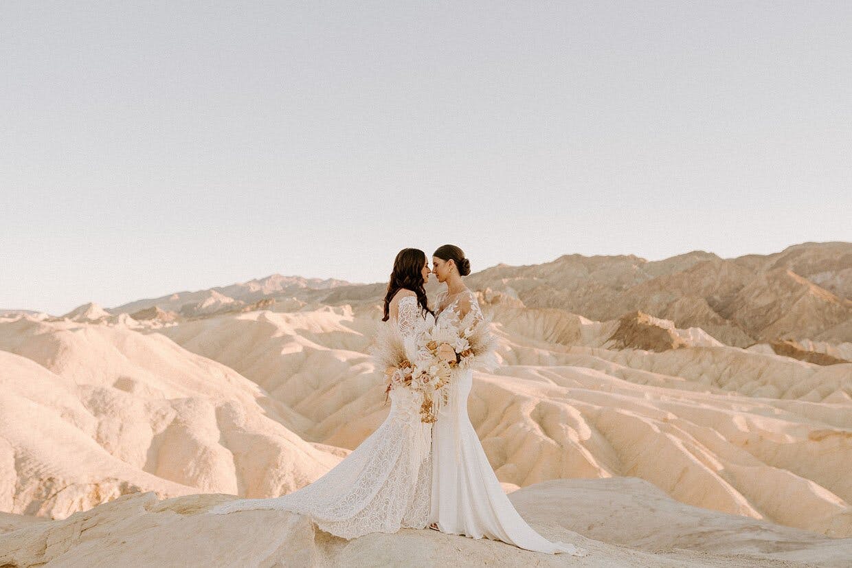 a couple on a beautiful sand dune on their wedding day