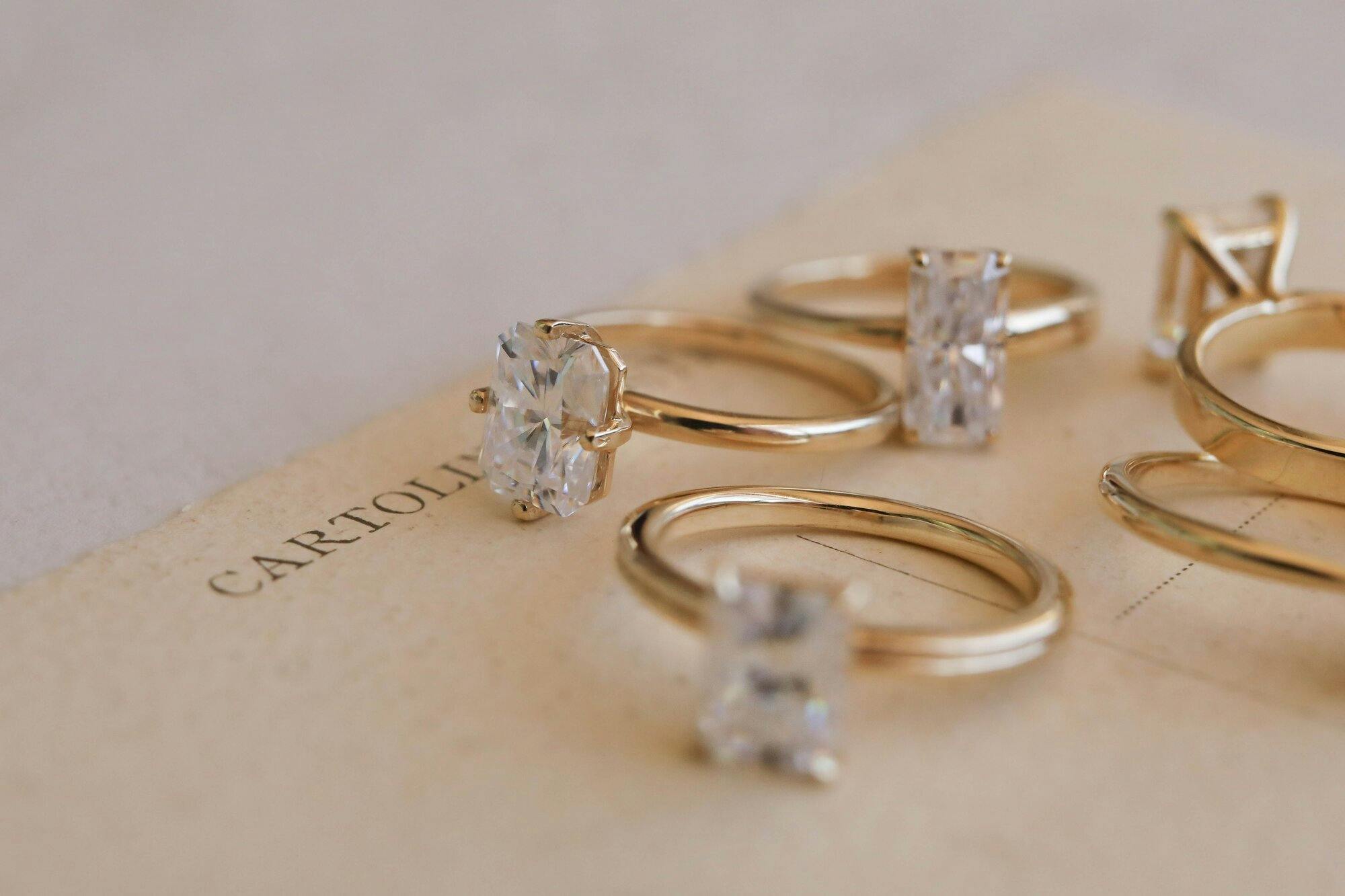 a group photo of engagement rings