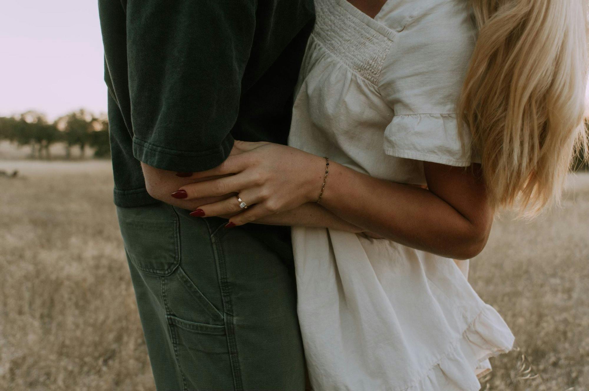 a couple hugging during their engagement shoot